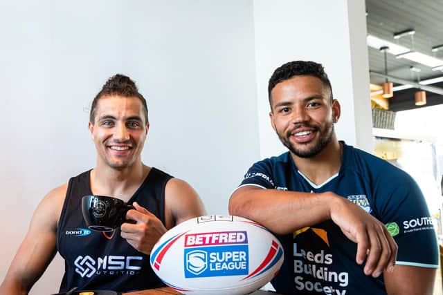 Giants' Ashton Golding, left and Kruise Leeming of Rhinos swapped clubs last autumn and could both make their debut tomorrow. They met at Golding's new business, Haus of Coffee, in Horsforth. Picture by Alex Whitehead SWpix.com