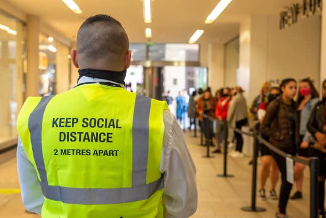 Queuing and social distancing is now normal for shopping.