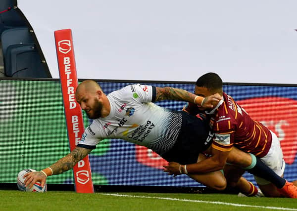 02 August 2020. Picture James Hardisty.
Huddersfield Giants v Leeds Rhino's, in the Betfred Super League match held at Emerald Headingley Stadium, Leeds. Pictured Luke Briscoe, of Leeds Rhinos, dives to score a try whilst been tackled by Darnell Mcintosh, of Huddersfield Giants.