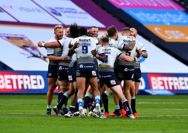 02 August 2020. Picture James Hardisty.Huddersfield Giants v Leeds Rhino's, in the Betfred Super League match held at Emerald Headingley Stadium, Leeds. Pictured Luke Gale, of Leeds Rhinos, celebrates with his teammates after his drop kick wins the match for Leeds Rhino's.