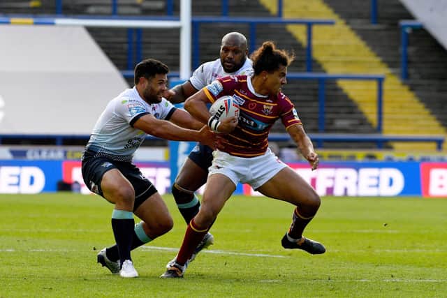 02 August 2020. Picture James Hardisty.
Huddersfield Giants v Leeds Rhino's, in the Betfred Super League match held at Emerald Headingley Stadium, Leeds. Pictured Rhyse Martin, of Leeds Rhinos, tackles Ashton Golding, of Huddersfield Giants.