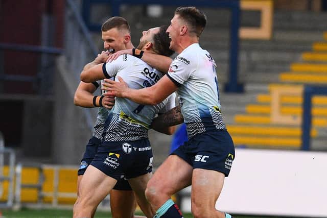 02 August 2020. Picture James Hardisty.
Huddersfield Giants v Leeds Rhino's, in the Betfred Super League match held at Emerald Headingley Stadium, Leeds. Pictured Luke Gale, of Leeds Rhinos, celebrates with his teammates after his drop kick wins the match for Leeds Rhino's.