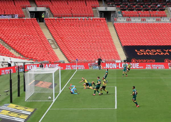SWEET MEMORIES: Harrogate Town's George Thomson scores his side's first goal against Notts County at Wembley Stadium. Picture: Catherine Ivill/Getty Images