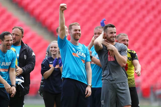 GUIDING HAND: Manager Simon Weaver of Harrogate Town celebrates after his team's 3-1 victory in the National League play-off final against Notts County at Wembley Stadium. Picture: Catherine Ivill/Getty Images