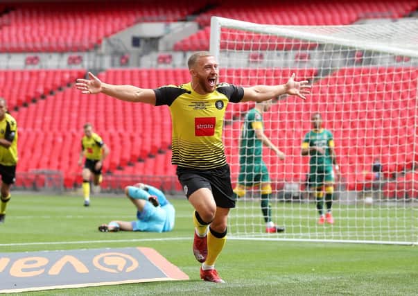 MAN OF THE MOMENT: George Thomson celebrates scoring Haoorgate Town's first goal against Notts County at Wembley Stadium. Picture: Catherine Ivill/Getty Images
