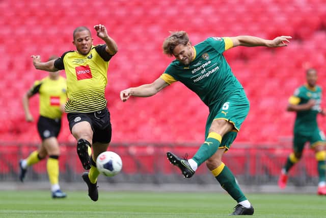 TOUGH GOING: Harrogate Town's Aaron Martin  battles for possession with Notts County's Ben Turner at Wembley Stadium. Picture: Catherine Ivill/Getty Images