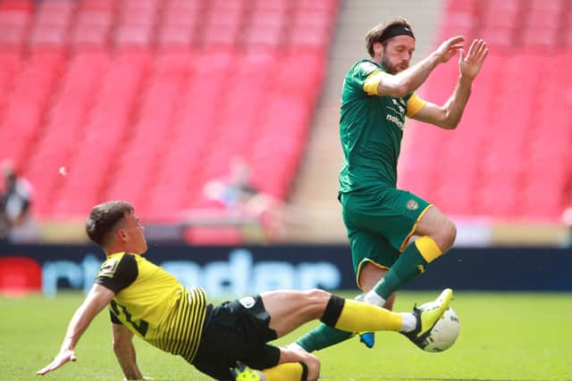 Harrogate Town's Ryan Fallowfield (left) and Notts County's Jim O'Brien battle for the ball at Wembley Stadium. Picture: Adam Davy/PA