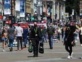 Shoppers wear face masks on Briggate, in Leeds.