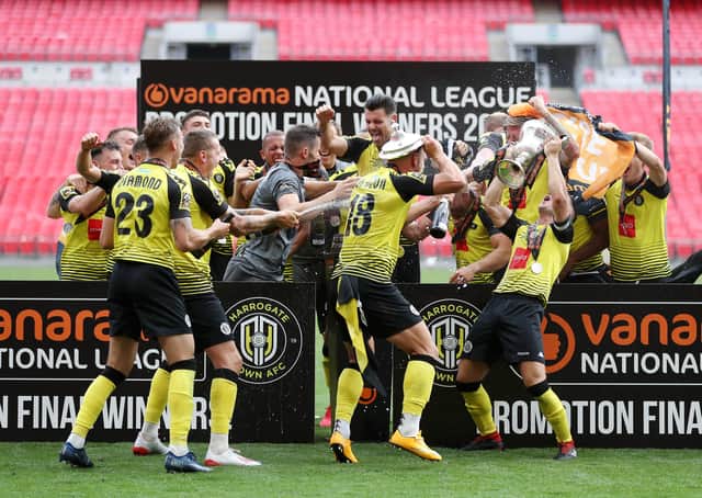 MAGIC MOMENT: Josh Falkingham of Harrogate Town lifts the trophy at Wembley Stadium. Picture: Catherine Ivill/Getty Images)
