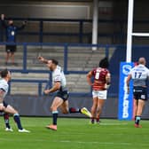 Luke Gale, third from left, jumps for joy after booting his golden point winner. Picture by James Hardisty.