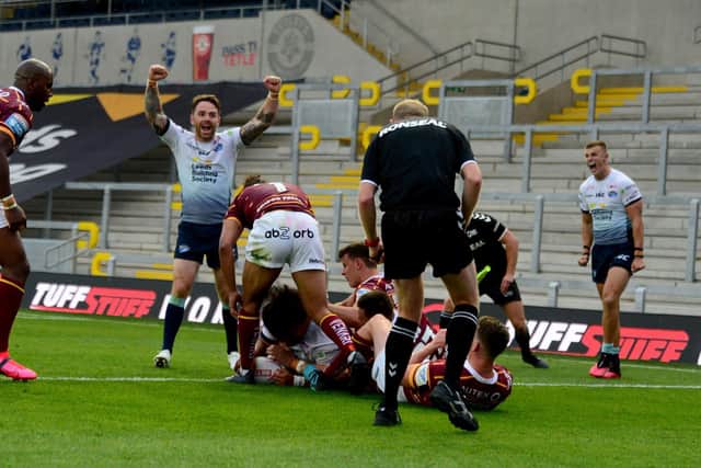 Konrad Hurrell's late try edged Rhinos to within two points of Giants. Picture by James Hardisty.
