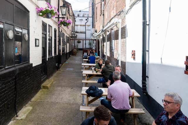 Customers outside Whitrelock's in Leeds city centre on Monday lunchtime.
Photo: James Hardisty