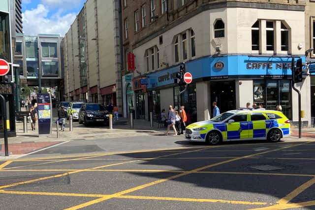Police on the bottom of Albion Street after a masked man robbed the Nationwide bank before running through the Trinity Leeds Shopping Centre.