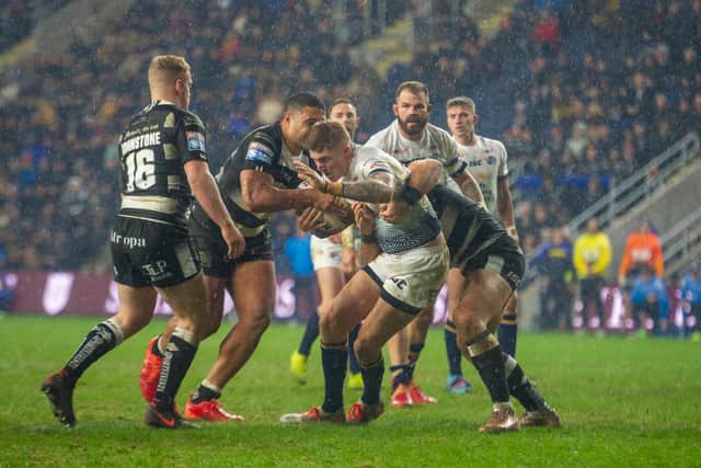 Liam Sutcliffe takes on Hull's defence in Super League round one. Picture by Tony Johnson.