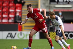 DEBUT: Aberdeen's Leeds United loanee Ryan Edmondson looks to hold off Scott Arfield in Saturday's clash against Rangers. Photo by Andrew Milligan/Pool via Getty Images.