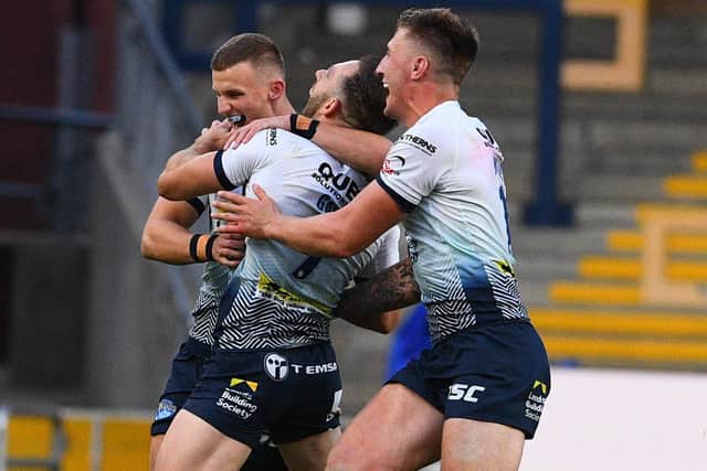MATCH WINNER: Luke Gale celebrates with his team-mates after his drop goal defeated Huddersfield Giants on Sunday. Picture: James Hardisty.