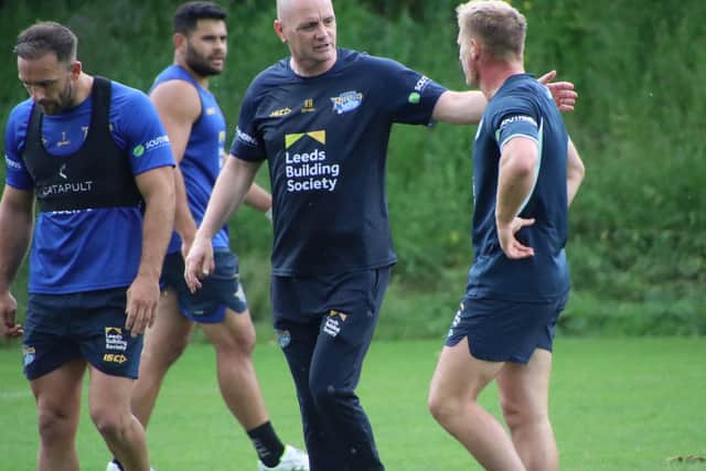 Rhinos coach Richard Agar talks to Brad Dwyer at training this week. Picture by Varley Picture Agency.
