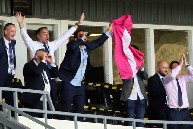 SEARCHING - Leeds United director of football Victor Orta, pictured with binoculars at Derby County, has been hunting for cover and competition for Pablo Hernandez and Patrick Bamford. Pic: Andrew Varley