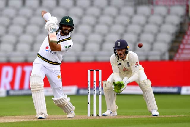 Pakistan's Shan Masood drives through the covers on day one of the Test match against England at Old Trafford. Picture: Dan Mullan/NMC Pool/PA