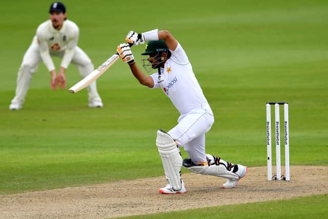 CLASS ACT: Pakistan's Babar Azam drives through the covers on day one of at Old Trafford. Picture: Dan Mullan/NMC Pool/PA