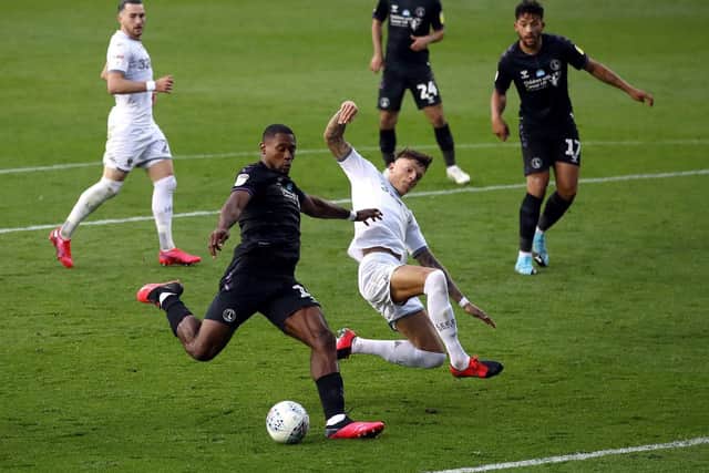 EVER PRESENT: Leeds United's Brighton loanee Ben White looks to thwart Chuks Aneke in the season finale at home to Charlton Athletic. Picture by Tim Goode/PA Wire.
