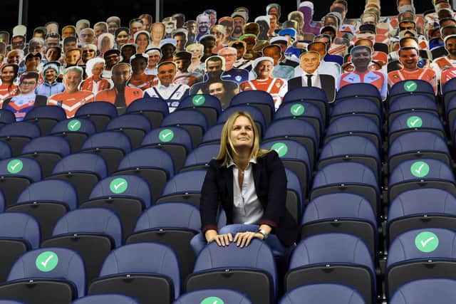 Sian Jones,head of customer experience at leeds Rhinos,in  the stands  front of images of fans printed on  carboard cut outs at Emerald Headingley.
Picture: Gary Longbtottom