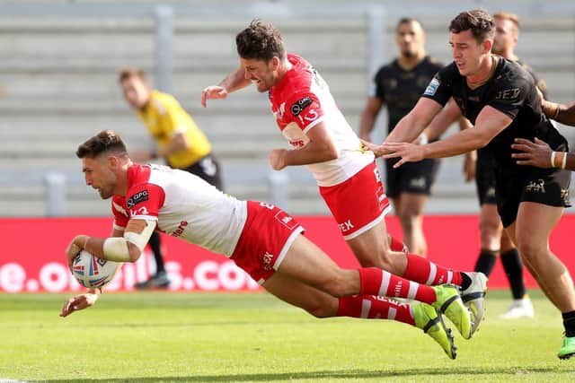 Tommy Makinson scores for St Helens in last week's win over Catalans. Picture by Martin Rickett PA Wire.