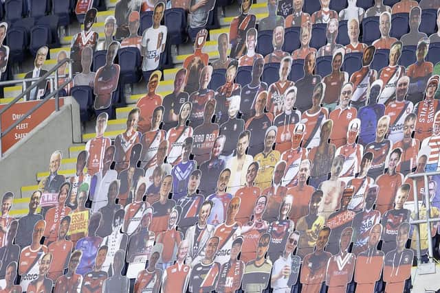 Photos of Leeds Rhinos fans on cardboard cutouts at Emerald Headingley stadium.
Picture; Gary Longbottom