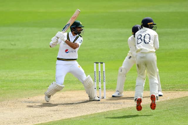 Pakistan's Shan Masood (left) in action during day two of the First Test match at the Emirates Old Trafford, Manchester. PA Photo. Issue date: Thursday August 6, 2020. See PA story CRICKET England. Photo credit should read: Dan Mullan/NMC Pool/PA Wire. RESTRICTIONS: Editorial use only. No commercial use without prior written consent of the ECB. Still image use only. No moving images to emulate broadcast. No removing or obscuring of sponsor logos.