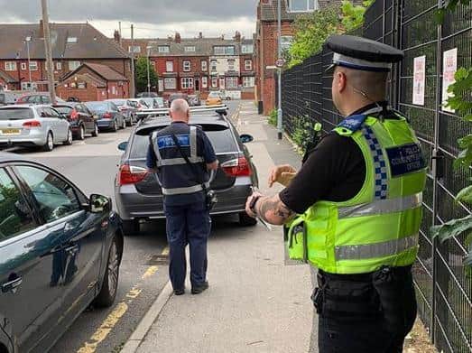 Police issued fines for illegal parking in Harehills. Photo: West Yorkshire Police