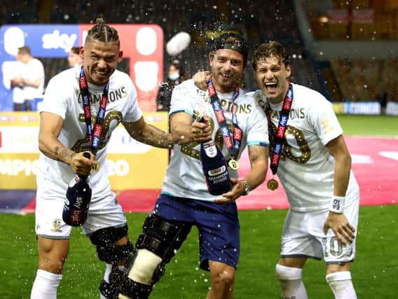 Leeds United midfielder Kalvin Phillips (left) celebrates with Gaetano Berardi (middle) and Gjanni Alioski (right). (Picture: PA)