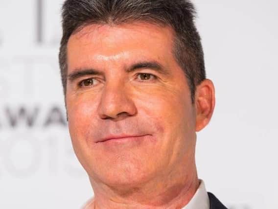 Simon Cowell is having surgery after breaking his back