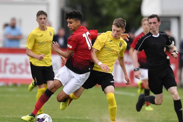 NEW BOY - Charlie Allen, right, in action against Manchester United for his county in the Milk Cup, has joined Leeds United from David Healy's Linfield. Pic: Getty