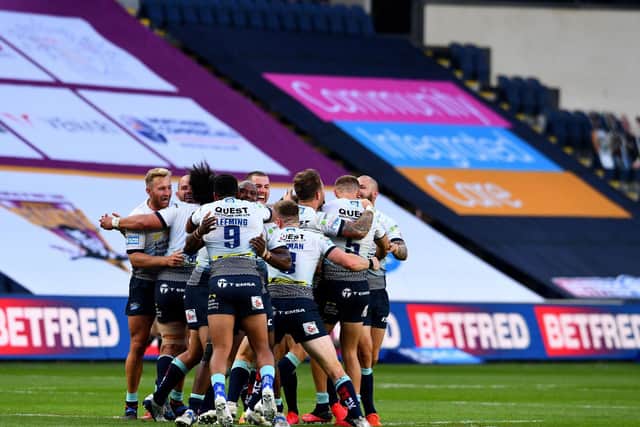 Rhinos celebrate their behind closed doors win over Huddersfield Giants. Picture by James Hardisty.