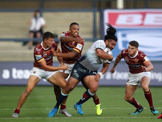 Konrad Hurrell on the charge against Huddersfield. Picture by Martin Rickett PA Wire.