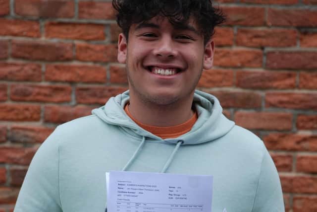 Jhat Thompson with his results at Woodkirk High School.