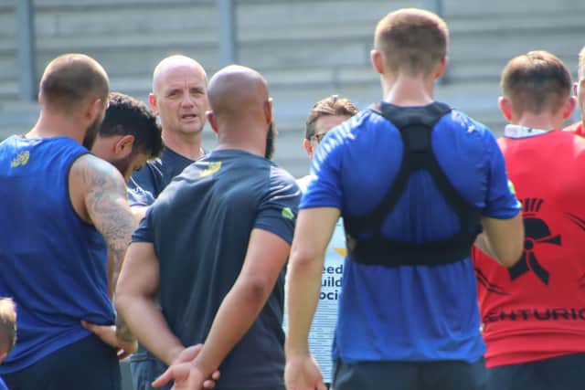 Rhinos coach Richard Agar speaks to his players at training on Friday. Picture by Phil Daly.