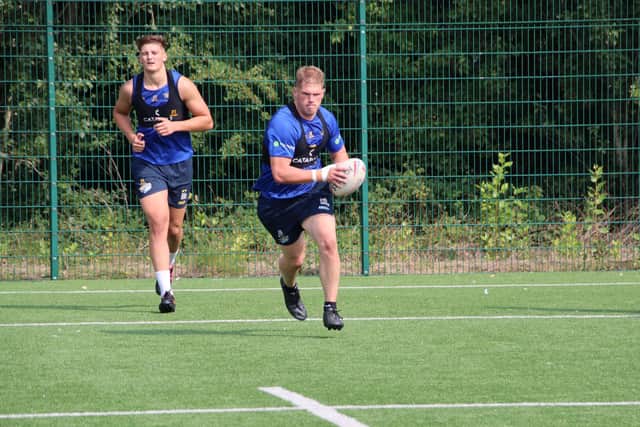 Tom Holroyd, right, is in Rhinos' 21-man squad for Sunday and could make his first appearance of 2020. Picture by Phil Daly.