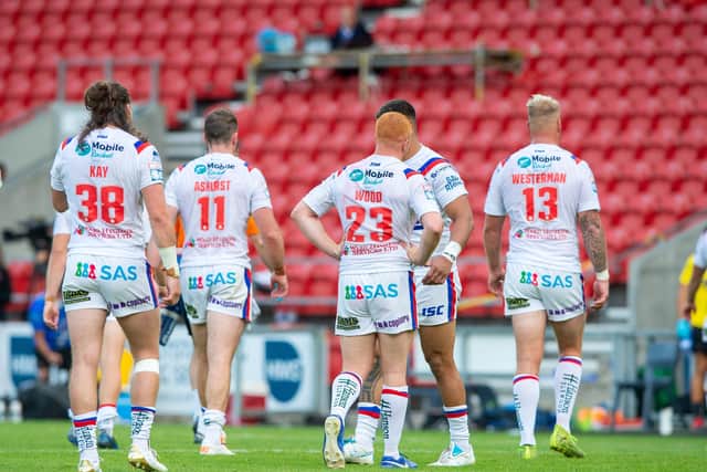 Dejected: Trinity players leave the pitch at full time.  Picture: Bruce Rollinson