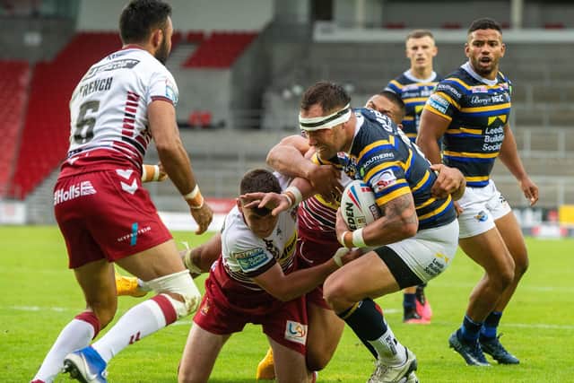Bodene Thompson is held short of the Wigan line. Picture: Bruce Rollinson/JPIMedia.