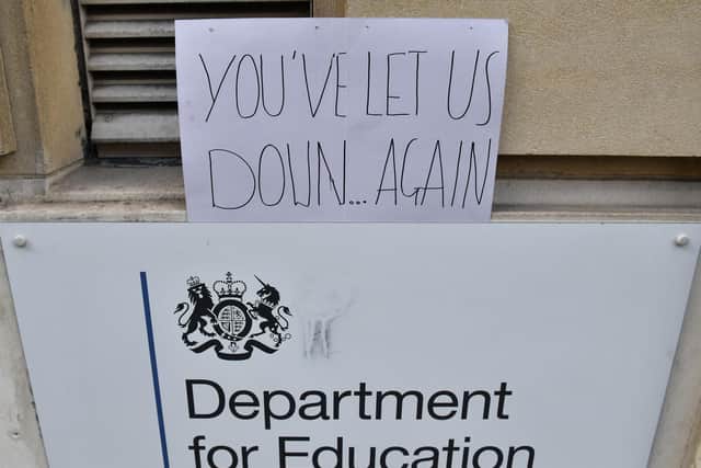 A sign left outside the Department for Education building in London, as a protest over the continuing issues of last week's A level results which saw some candidates receive lower-than-expected grades after their exams were cancelled as a result of coronavirus. Photo: PA