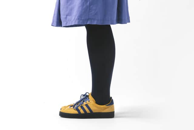 A nurse wears the Adidas Originals Spezial Elland 'Made for HIP' trainers.