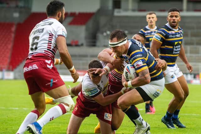Leeds Rhinos' debutant Bodene Thompson is held short of the Wigan line.
 Picture: Bruce Rollinson.