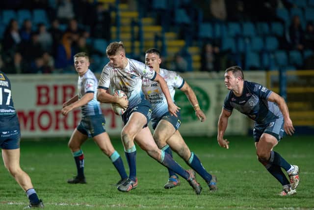 Sam Walters makes a break for Rhinos during a pre-season game at Featherstone. Picture by Bruce Rollinson.