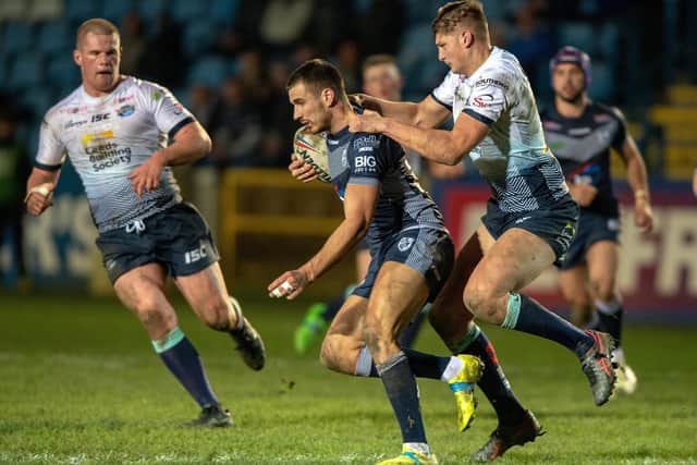 Sam Walters attempts to halt Featherstone's Gareth Gale. Picture by Bruce Rollinson.