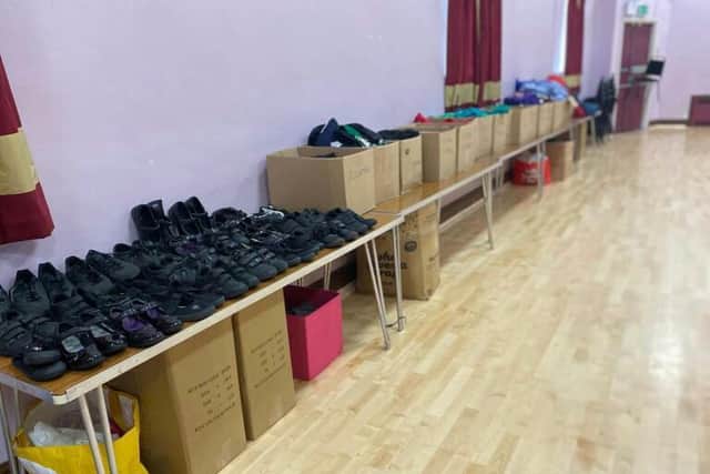 Rows and boxes of clothes and shoes have been donated to the Zero Waste school uniform re-use project.