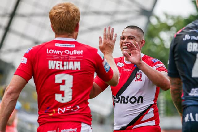 Salford's Kris Welham celebrates with Tui Lolohea after scoring against Hull FC. Hull and Salford’s fixtures last weekend were subsequently postponed after nine Hull players and three staff tested positive for Covid-19.
Picture: Alex Whitehead/SWpix.com
