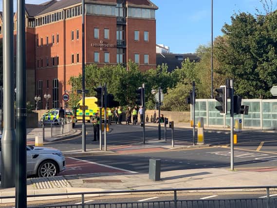 Police and ambulance are at the scene on Victoria Bridge over the River Aire