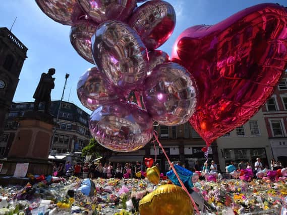 Tributes left to the 22 men, women and children killed in the Manchester Arena attack in Manchester city centre