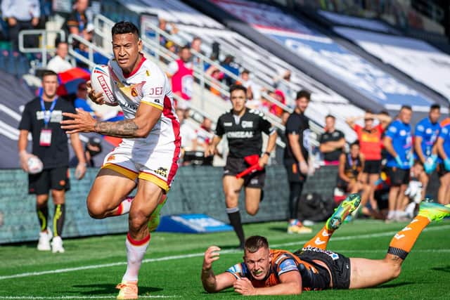 Catalans Dragons' Israel Folau scores against Castleford Tigers. Picture: Alex Whitehead/SWpix.com.